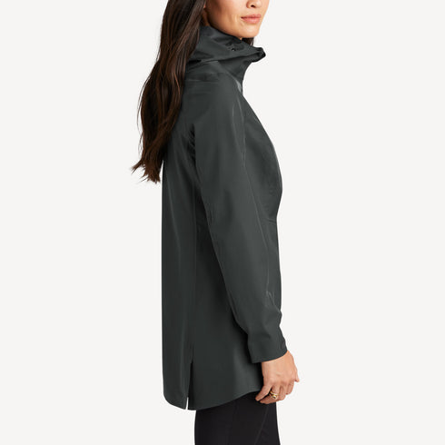 Side view of women’s gray long waterproof rain shell on model – Louvóre apparel